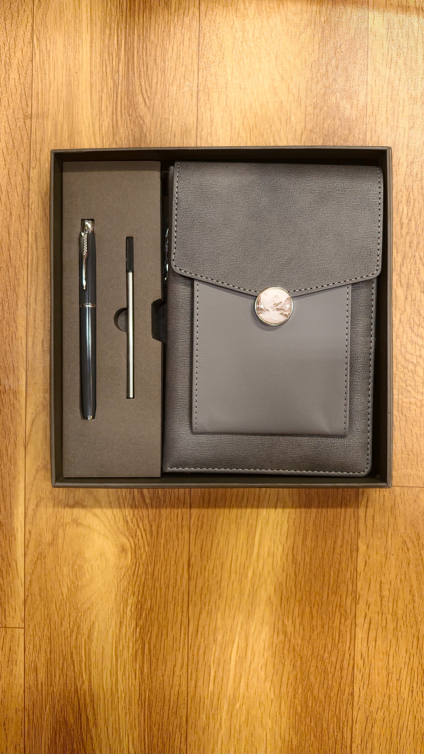3 in 1 Gift Set Grey PU Leather A5 Notebook with decorative moon button closure, a matching ballpoint pen, and a pen refill
