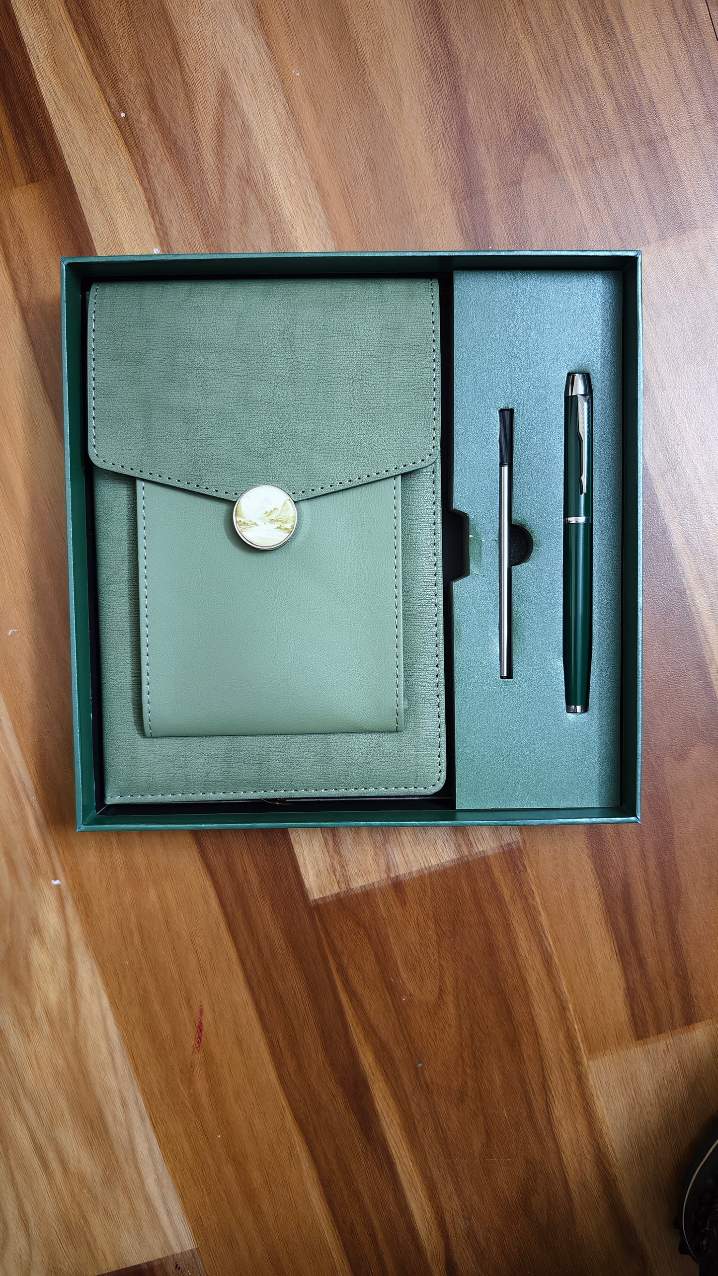 3 in 1 Gift Set Green PU Leather A5 Notebook with decorative moon button closure, a matching ballpoint pen, and a pen refill